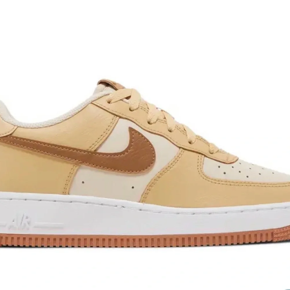 Nike Women’s Neutral Low-Top Sneakers in Cream and Brown